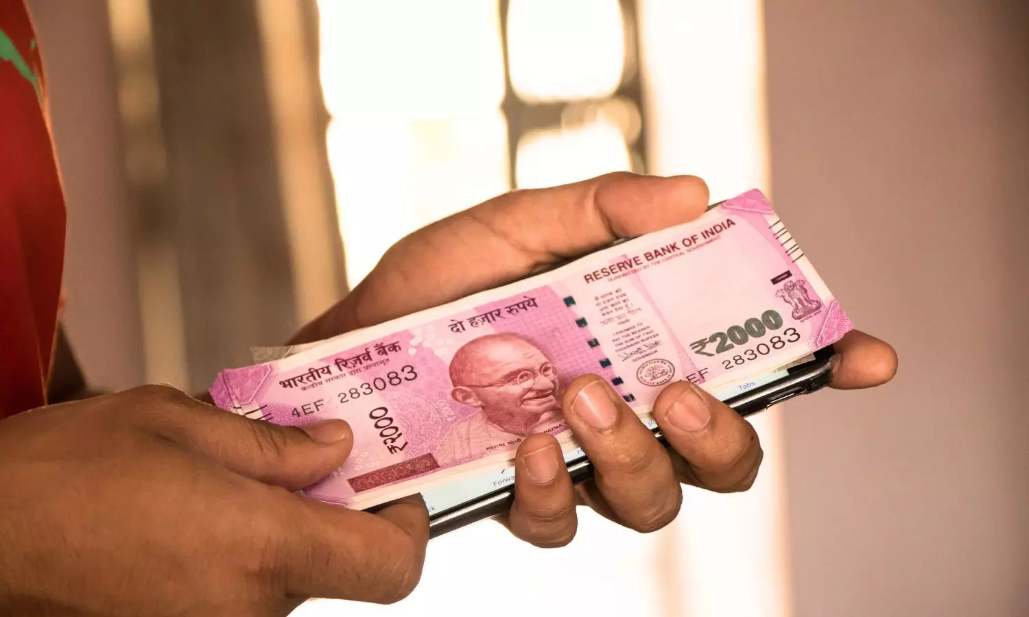 Indian rupee in hand