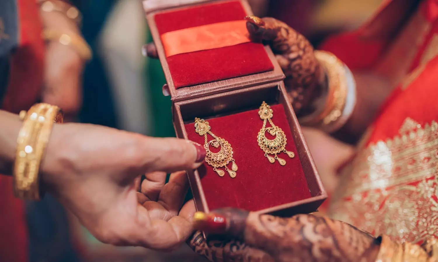 Gold ornaments in hand