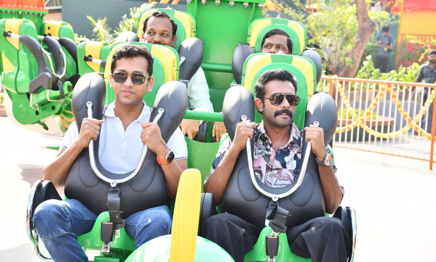 Actor Arjun Ashokan enjoys new ride Air Race in Wonderla Kochi with Wonderla Holidays Managing Director Arun K. Chittilappilly