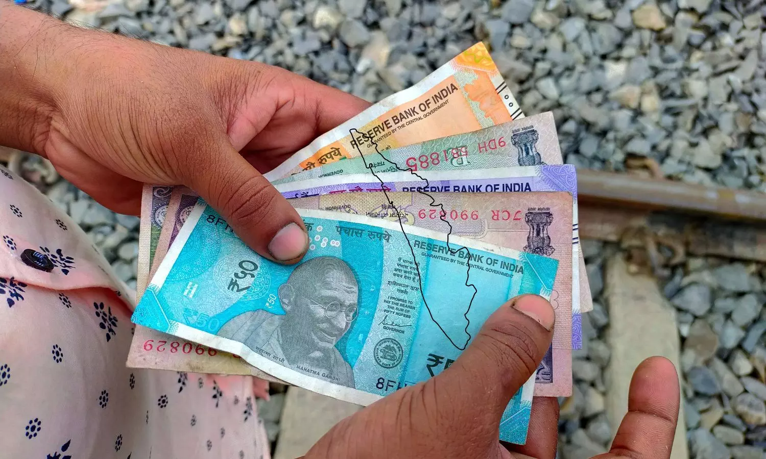 Indian Rupee in Hand