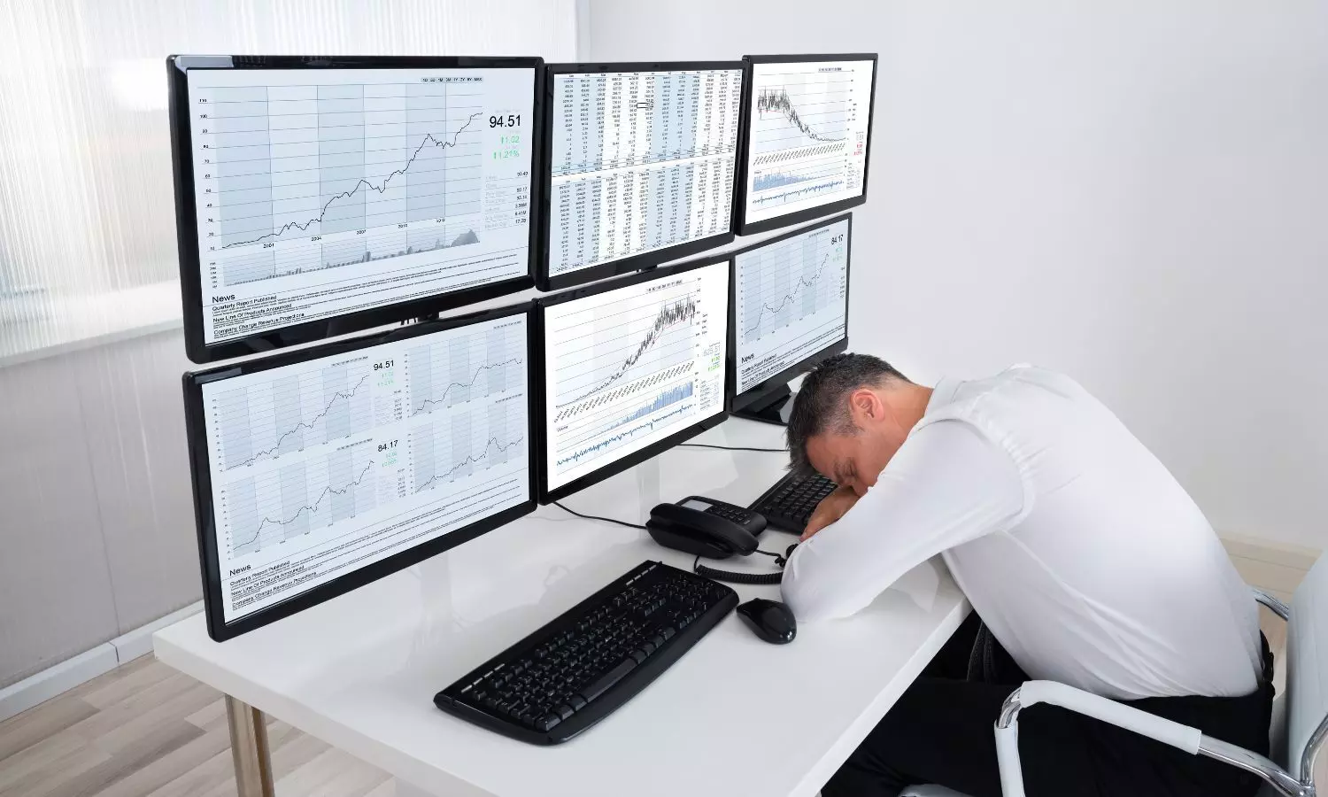 Stock market trader sleeps