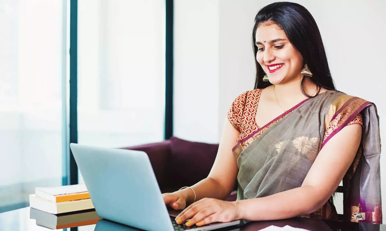 girl sitting in front of laptop