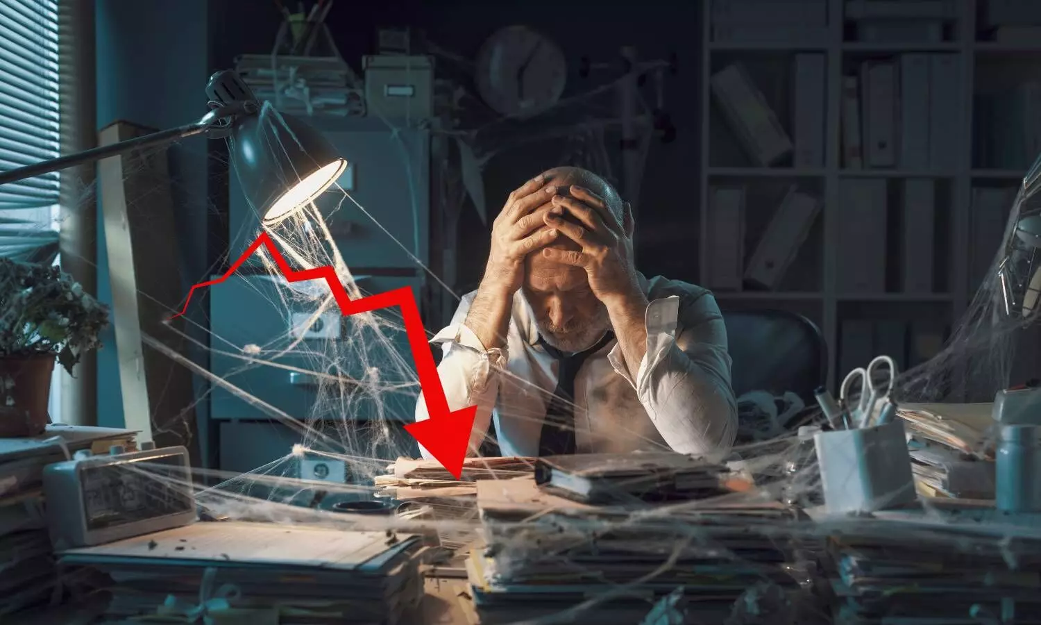 a man sitting in front of desk