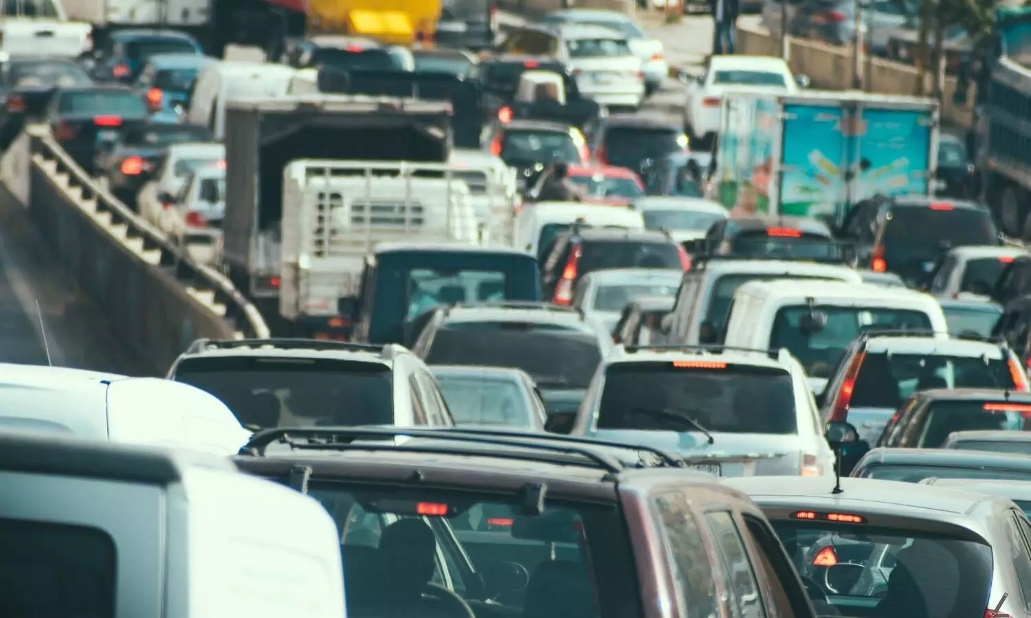 a number of vehicles in a busy highway