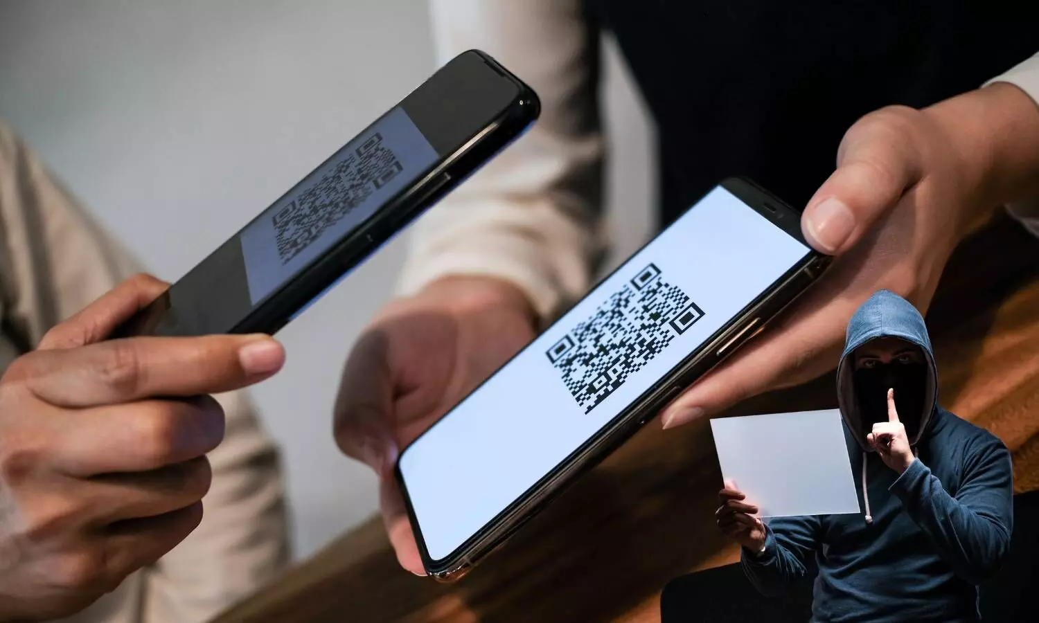 QR code scanning photo of a hacker