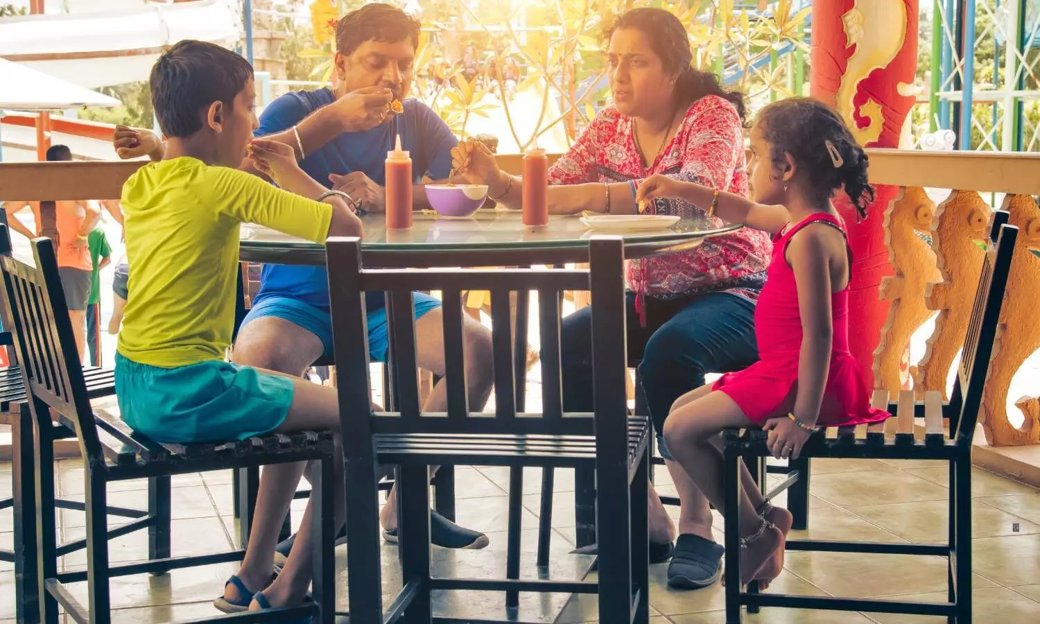 a family eating food in a restaurant