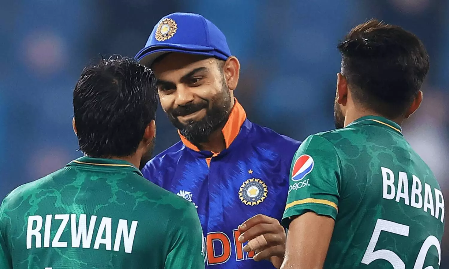 indian player virat kohli is talking with rizwan and babar