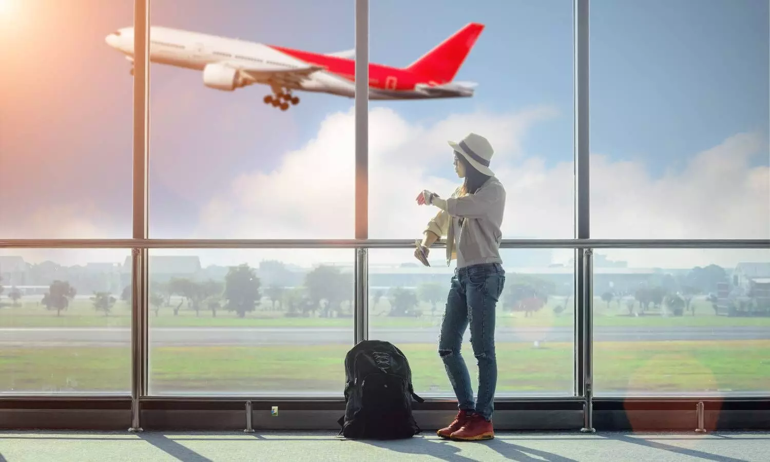 a woman looking out of a airport