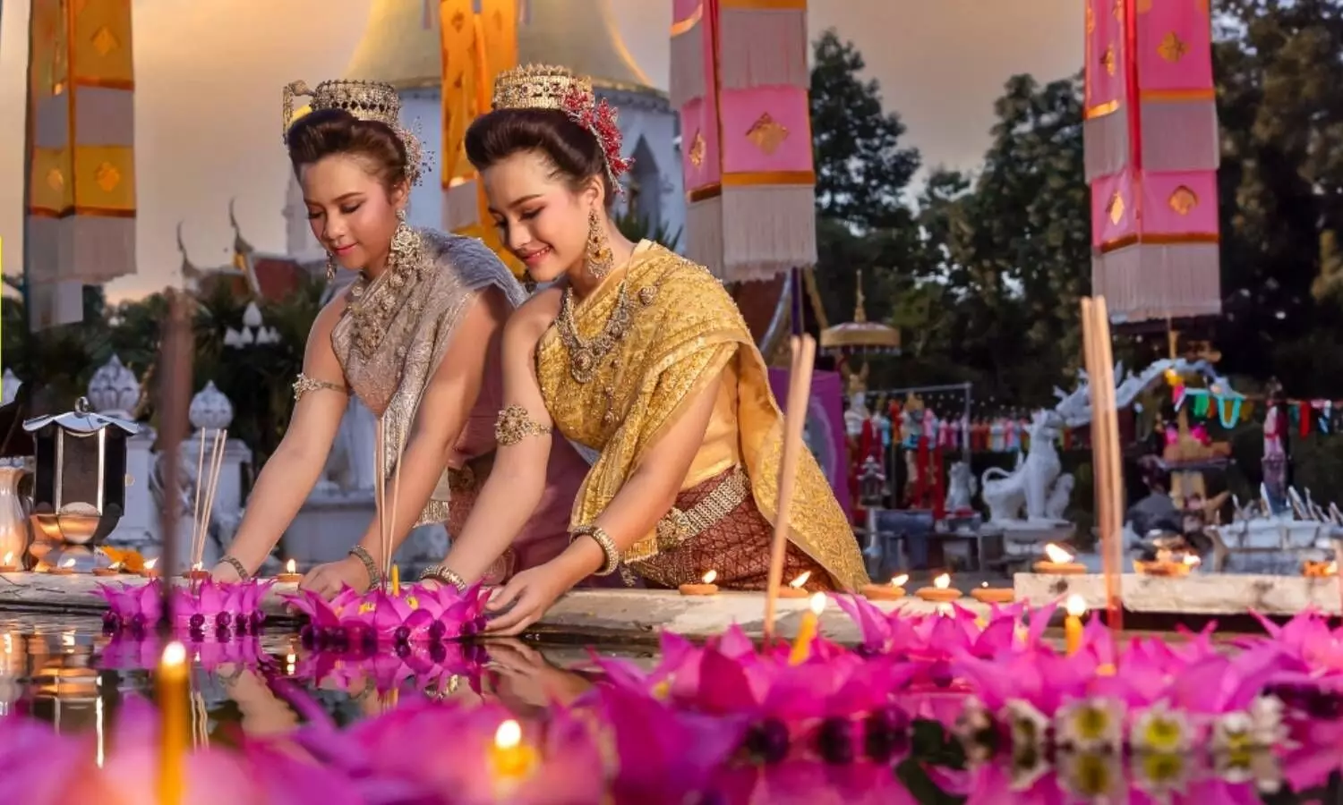 two thai women doing some rituals