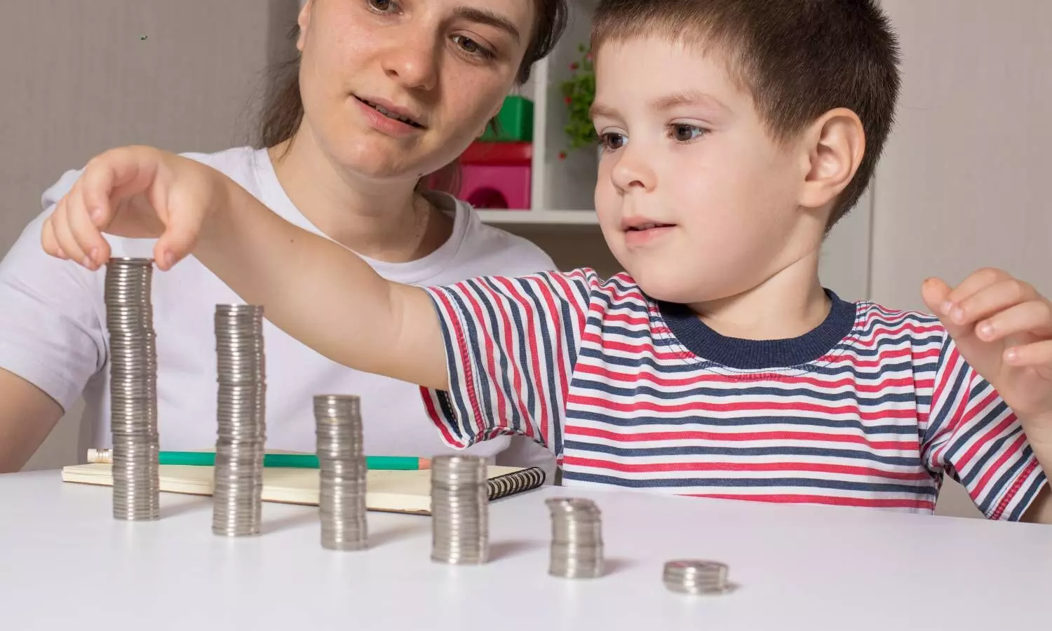 a mother and child saving money